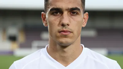 A close-up shot of Albian Ajeti's face, photorealistic skin texture and sharp focus on the eyes, with a clean white...