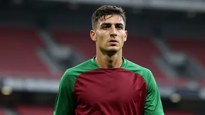 Mid-30s anonymous FC Basel midfielder, athletic build, waist-up, intense gaze, dark red and green training top with solid...