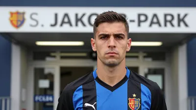 A photorealistic image of an anonymous FC Basel staff member, wearing a black and blue jersey, with a serious expression...